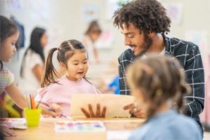 Man working with children